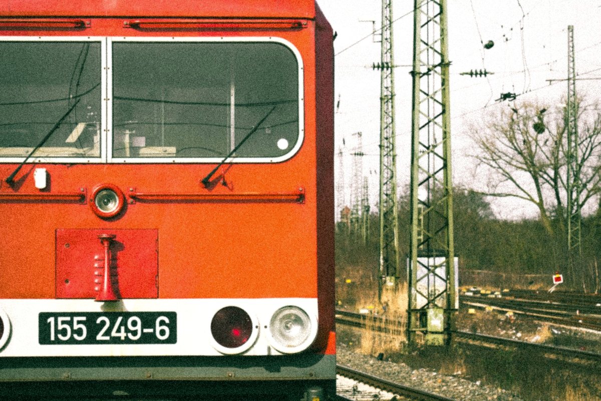 Electric locomotive beneath overhead railway power lines