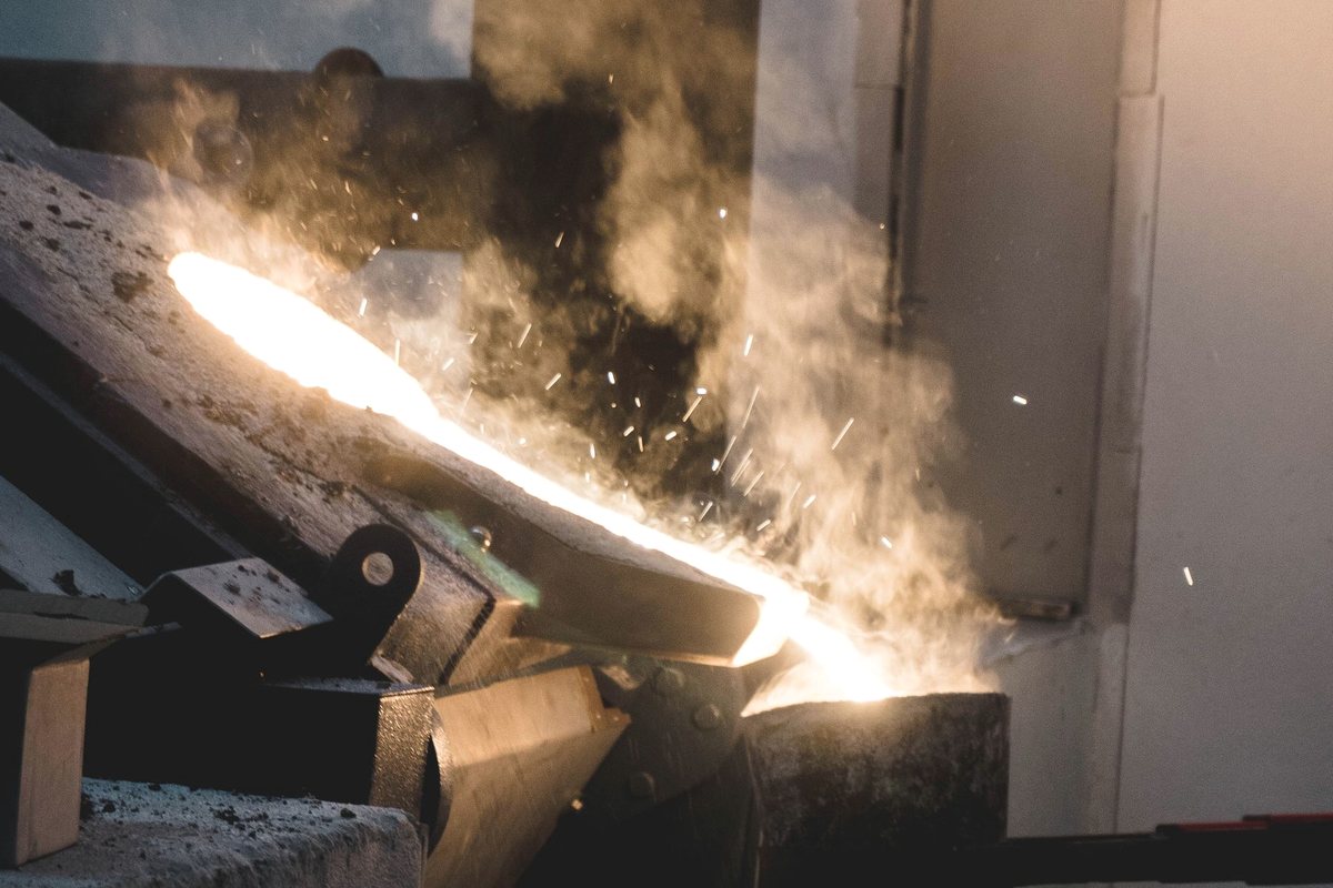 Molten metal flowing through foundry equipment