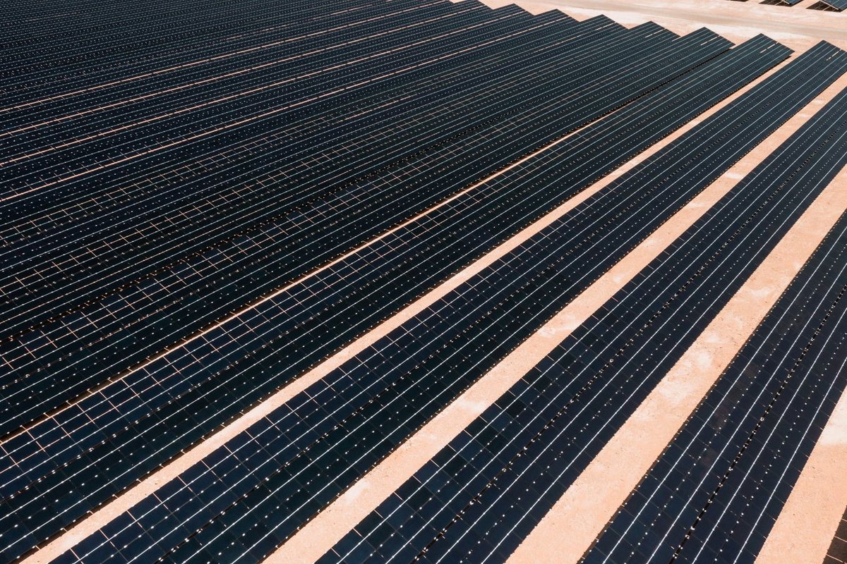 Rows of photovoltaic panels in a utility-scale solar farm