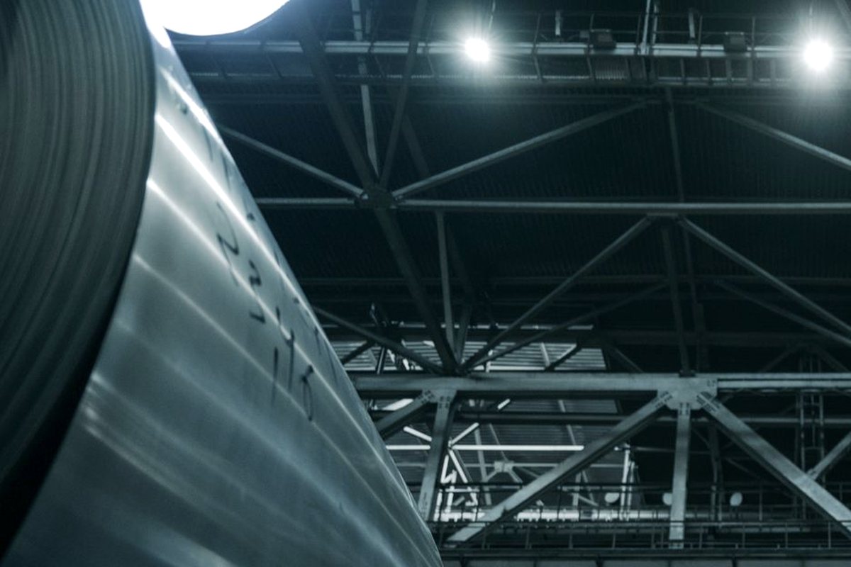 Rolled steel coils inside a modern steel mill
